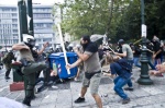 Riots during a rally against plans for new austerity measures///Protestors clash with riot police during a demonstration near the parliament in the center of Athens. 
 © Maro Kouri
