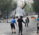 Riots during a rally against plans for new austerity measures///Protesters clash with riot police 
 © Maro Kouri